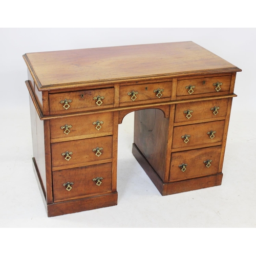 992 - A Victorian mahogany twin pedestal kneehole desk, the rectangular moulded top over three frieze draw... 