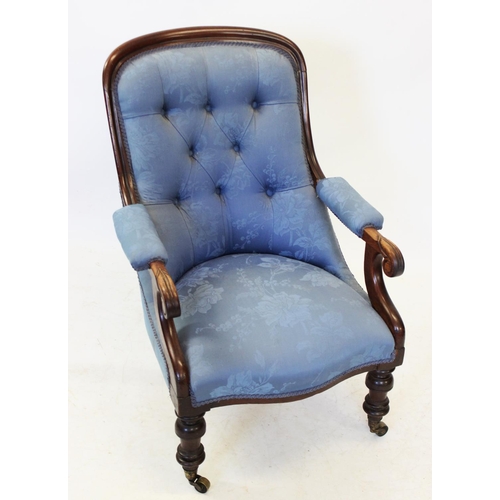 993 - A Victorian mahogany and upholstered open armchair, the button back within a mahogany frame, extendi... 