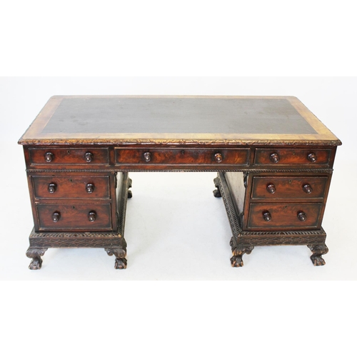 997 - A Victorian mahogany twin pedestal desk, the rectangular top with inset writing surface, enclosed by... 