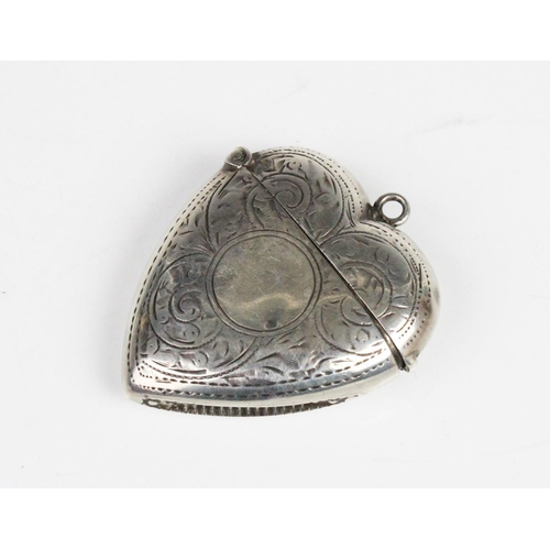 1 - An Edwardian silver heart-shaped vesta by Samuel M Levi, Birmingham 1906, with scrolling foliate dec... 