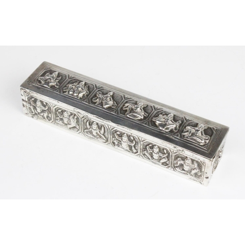 107 - A Burmese white metal box of rectangular form with embossed decorative panels to cover and sides dep... 