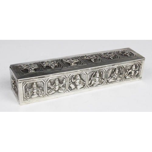 107 - A Burmese white metal box of rectangular form with embossed decorative panels to cover and sides dep... 