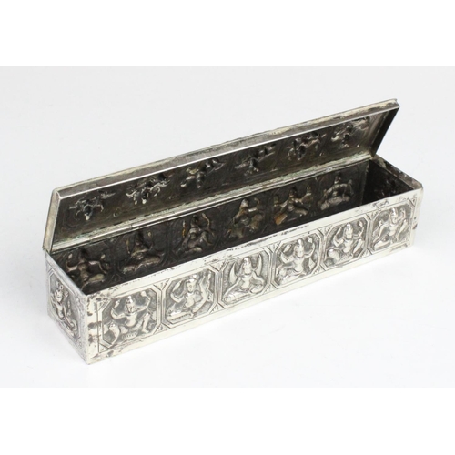 107 - A Burmese white metal box of rectangular form with embossed decorative panels to cover and sides dep... 