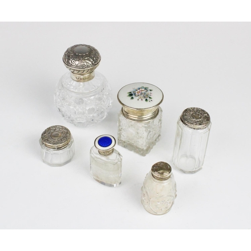 109 - A selection of silver and white metal mounted dressing table jars, to include a cut glass, silver an... 