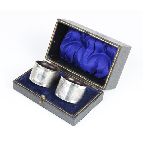 138 - A pair of silver napkin rings by Joseph Gloster Ltd, Birmingham 1934/35, each of circular form with ... 