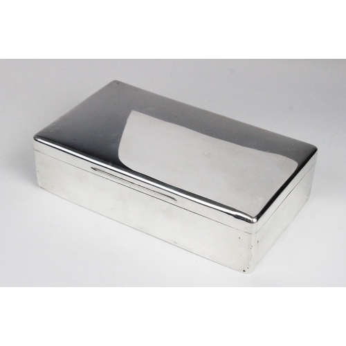 15 - A silver cigarette box by George Henry Cowell, London 1919, of plain polished rectangular form with ... 