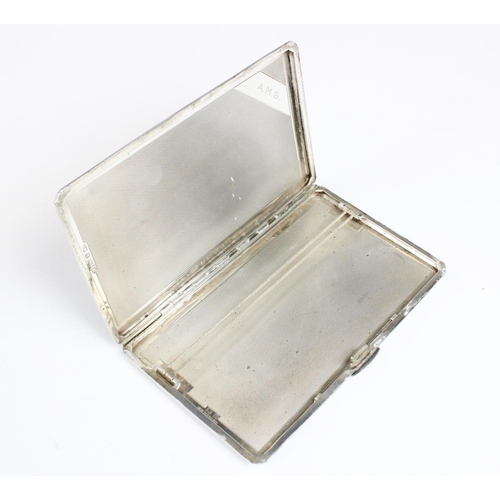 16 - A silver cigarette case by A Wilcox, Birmingham 1949, of rectangular form with canted corners and en... 