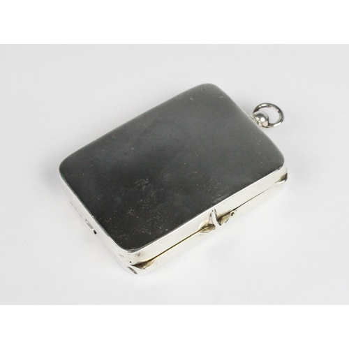 18 - A George V silver compact by Henry Williamson Ltd, Birmingham 1914, of plain polished rectangular fo... 
