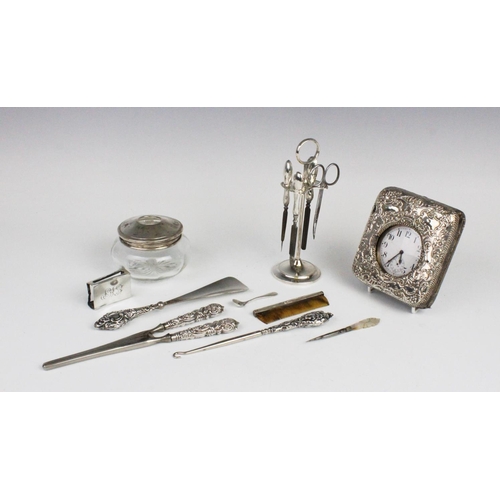 21 - A selection of silver and white metal lady's dressing table accessories, to include an Edwardian sil... 