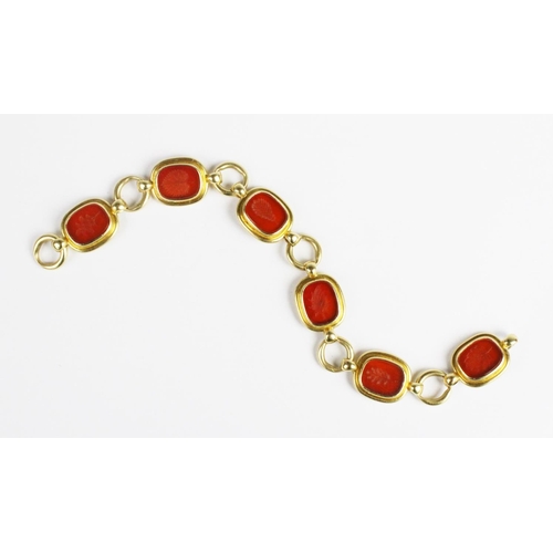 226 - An Elizabeth Gage intaglio set 18ct gold bracelet, comprising six rectangular carnelian panels, each... 