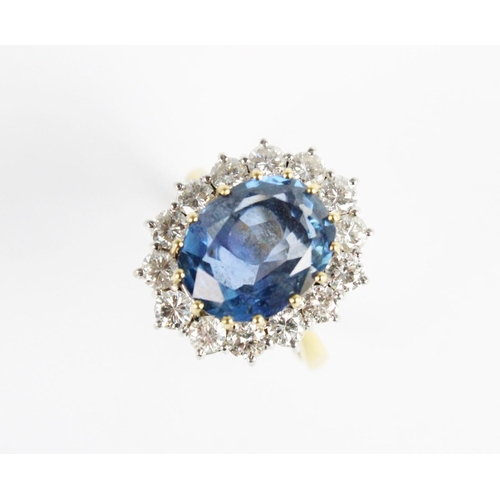 258 - A sapphire and diamond cluster ring, the central untested oval mixed cut sapphire (measuring 12.54mm... 