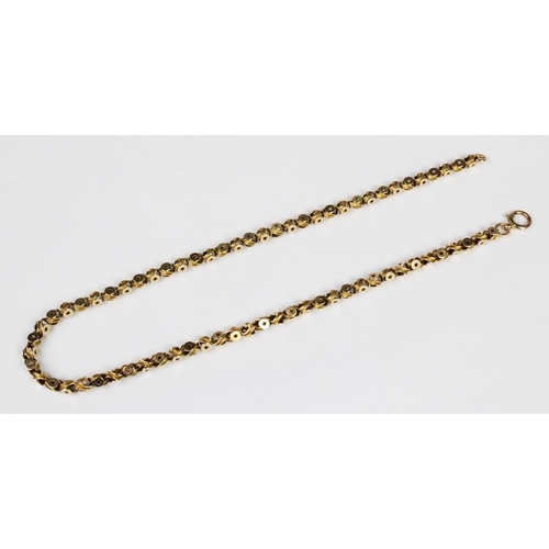 274 - A Victorian chain, in a scrolling star-pierced link design, with spring ring and loop fastening, sta... 