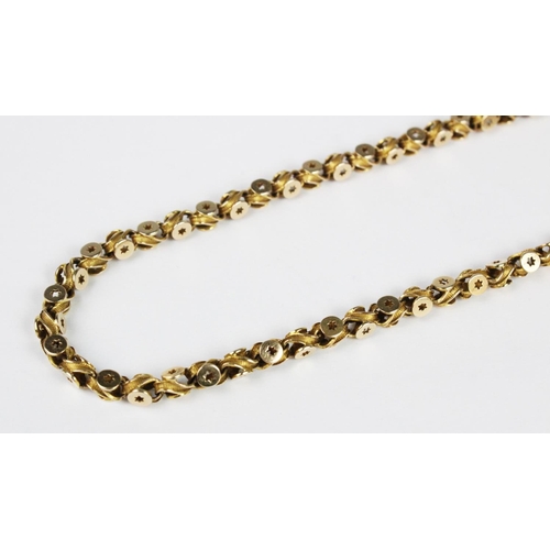 274 - A Victorian chain, in a scrolling star-pierced link design, with spring ring and loop fastening, sta... 