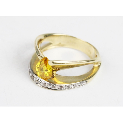 290 - A 14ct gold stone set dress ring, comprising an untested pear cut yellow gemstone (measuring 8mm x 6... 