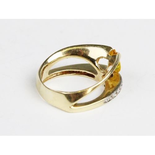 290 - A 14ct gold stone set dress ring, comprising an untested pear cut yellow gemstone (measuring 8mm x 6... 