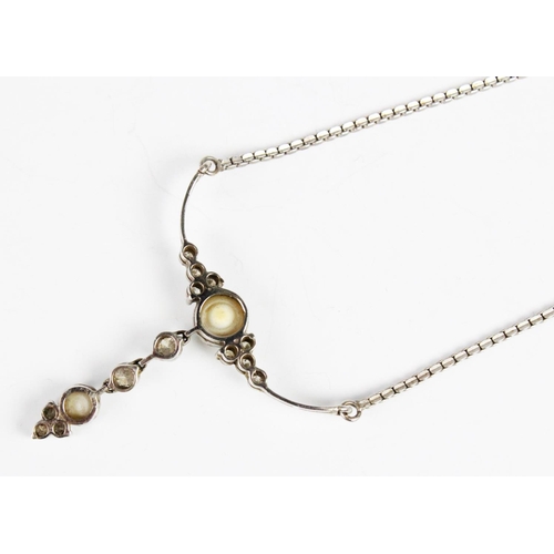 303 - A mabe pearl and diamond drop pendant, comprising a round mabe pearl, 7mm diameter, with four round ... 