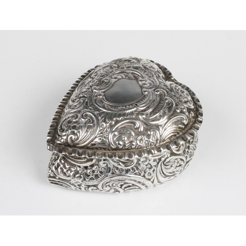 4 - A Victorian heart shaped silver box by William M Hayes, Birmingham 1897, with embossed scrolling dec... 