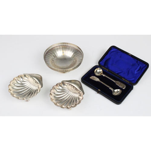 5 - A pair of Edwardian silver shell form butter dishes by Atkin Brothers, Sheffield 1905, each raised o... 