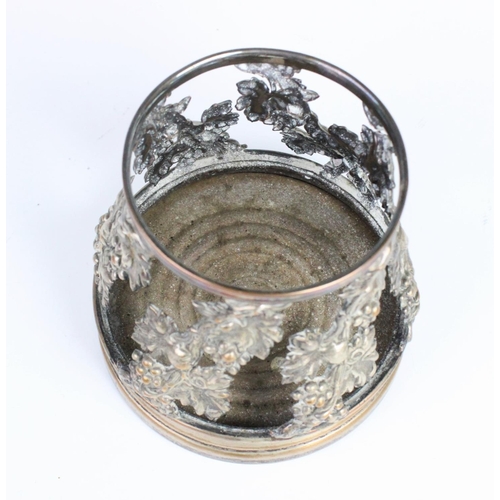52 - An early 20th century silver plated bottle coaster, with pierced scrolling grape and vine decoration... 