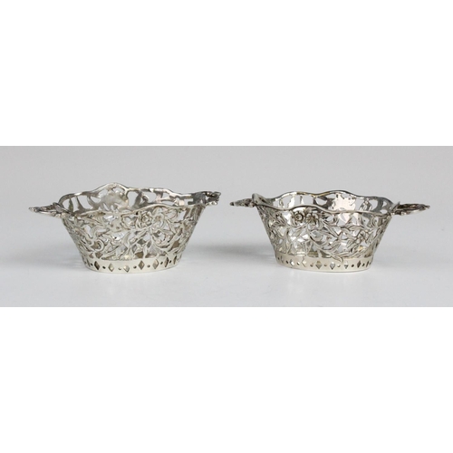 58 - A pair of Edwardian Continental silver miniature twin handled baskets, each of oval form with shaped... 