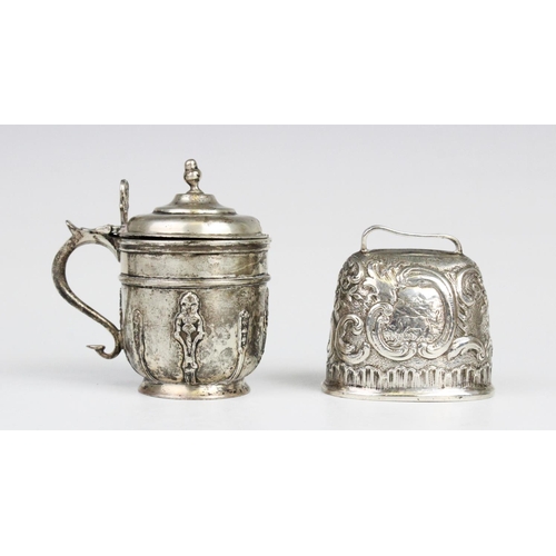 8 - A 19th century continental silver cow bell, of tapering oval form with embossed scrolling decoration... 