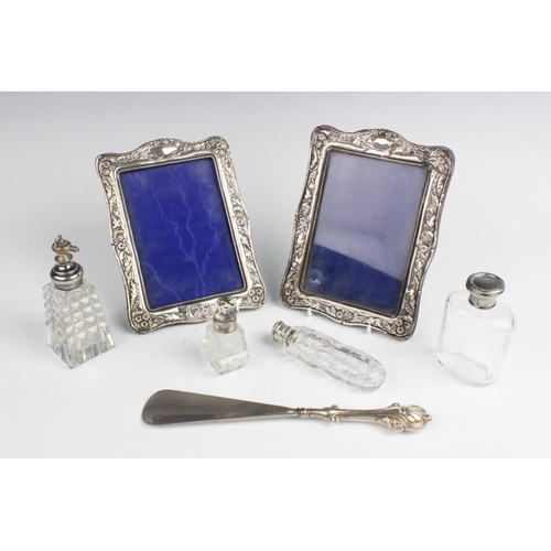 82 - A pair of Edwardian silver mounted photograph frames by Henry Matthews, Birmingham 1903, each of rec... 