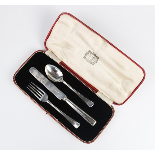 86 - An Art Deco three piece silver Christening set by Lee & Wigfull, Sheffield 1935, comprising a spoon,... 