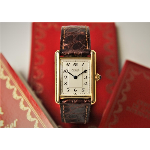 153 - A lady's Must de Cartier silver gilt Tank Vermeil wristwatch, the rectangular cream dial with Arabic... 