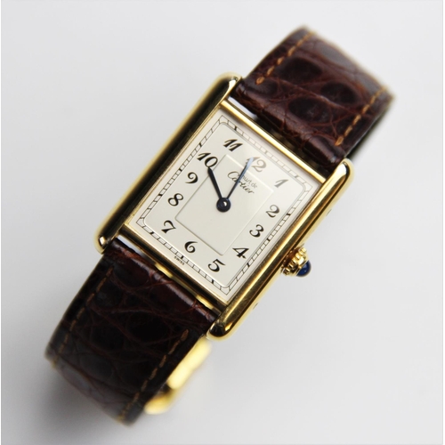 153 - A lady's Must de Cartier silver gilt Tank Vermeil wristwatch, the rectangular cream dial with Arabic... 