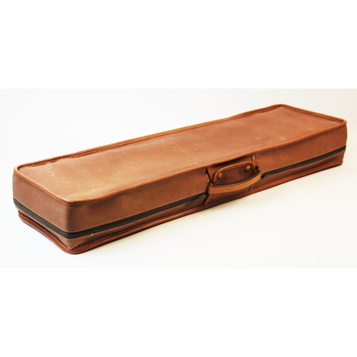 413 - A leather bound 12 bore shotgun case and weather cover, the tan leather case with reinforced corners... 