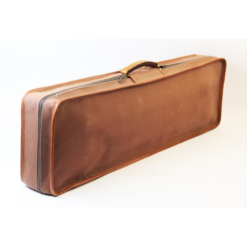 413 - A leather bound 12 bore shotgun case and weather cover, the tan leather case with reinforced corners... 