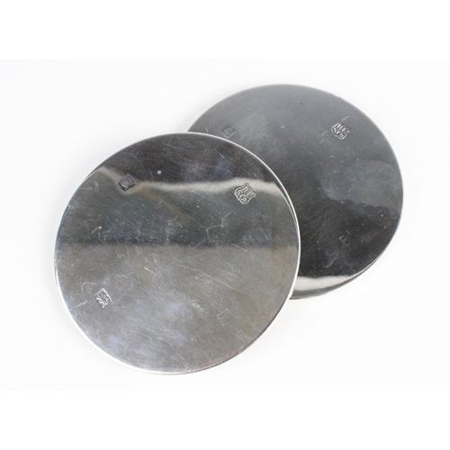 77 - A pair of silver mounted coasters by Barker Ellis Silver Co, Birmingham 1970, of plain polished circ... 