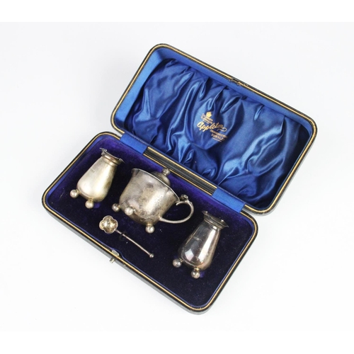 85 - A cased three piece Edwardian silver condiment set by Atkin Brothers, Sheffield 1906, comprising two... 