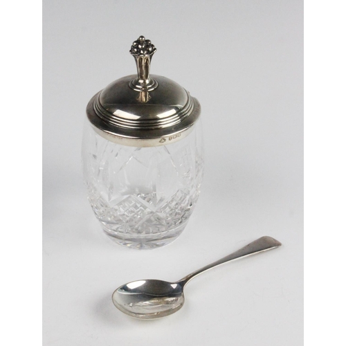 88 - A cut glass preserve jar with silver cover, the jar of baluster form with star cut base, the stepped... 