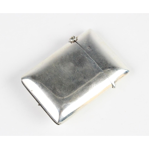 91 - An Edwardian silver vesta, marks for Birmingham 1903 (maker's mark worn), of plain polished rectangu... 