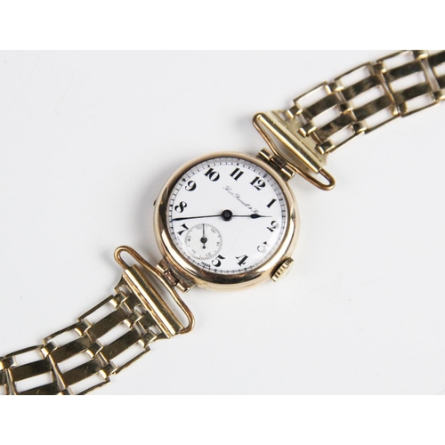 174 - A George V 9ct gold wristwatch by Thomas Russell & Son, the round white dial with Arabic numerals an... 