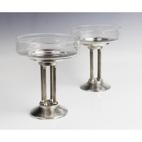 380 - A pair of Art Deco tazzas, the shallow glass dishes with etched geometric motifs, raised on white me... 