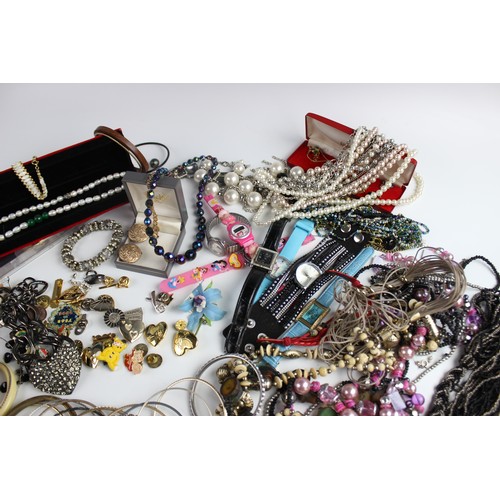 246 - A large collection of vintage and modern costume jewellery, including beaded necklaces, chains, bang... 