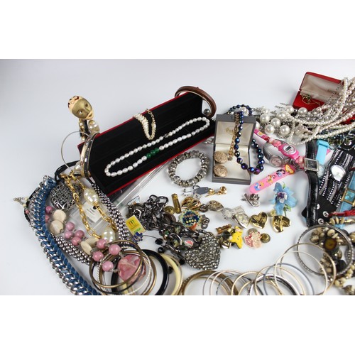 246 - A large collection of vintage and modern costume jewellery, including beaded necklaces, chains, bang... 