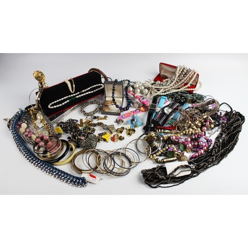 246 - A large collection of vintage and modern costume jewellery, including beaded necklaces, chains, bang... 