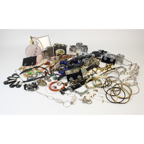 246 - A large collection of vintage and modern costume jewellery, including beaded necklaces, chains, bang... 