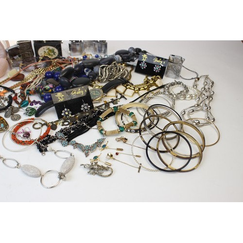 246 - A large collection of vintage and modern costume jewellery, including beaded necklaces, chains, bang... 