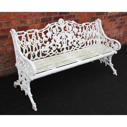 1053 - A Victorian painted cast iron Coalbrookdale style garden bench, the cast scrolling openwork naturali... 