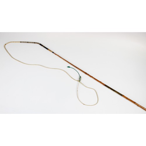 418 - An early 20th century carriage whip by Swaine and Adeney, with a leather handle and gilt metal mount... 