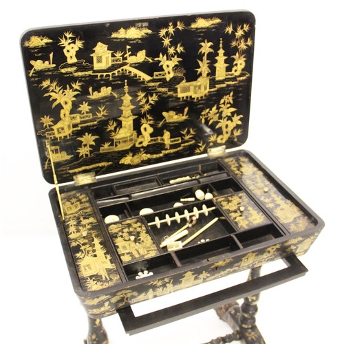 971 - A William IV Canton lacquer chinoiserie sewing table, applied with gilt decoration depicting figures... 