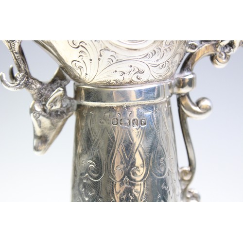 102A - A Victorian silver mounted cut glass claret jug, marks for 'WP', Sheffield 1876, of tapering form on... 