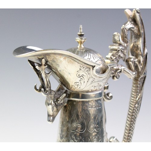 102A - A Victorian silver mounted cut glass claret jug, marks for 'WP', Sheffield 1876, of tapering form on... 