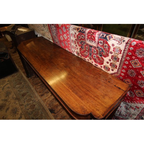 1039 - A mid 19th century mahogany console table, the shaped top above a plain frieze, raised upon tapering... 