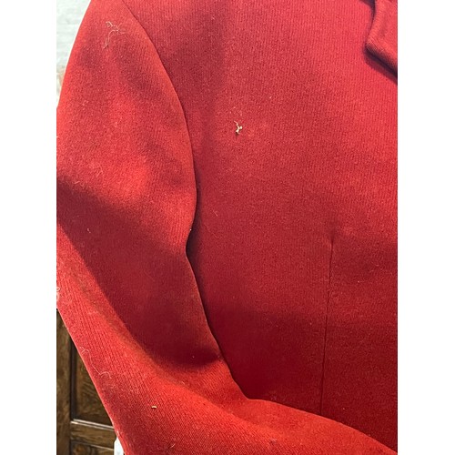 420 - A scarlet evening hunt jacket with tails and gilt buttons, satin lined, 110cm long, along with a sca... 