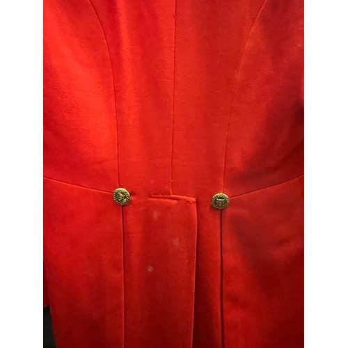 420 - A scarlet evening hunt jacket with tails and gilt buttons, satin lined, 110cm long, along with a sca... 